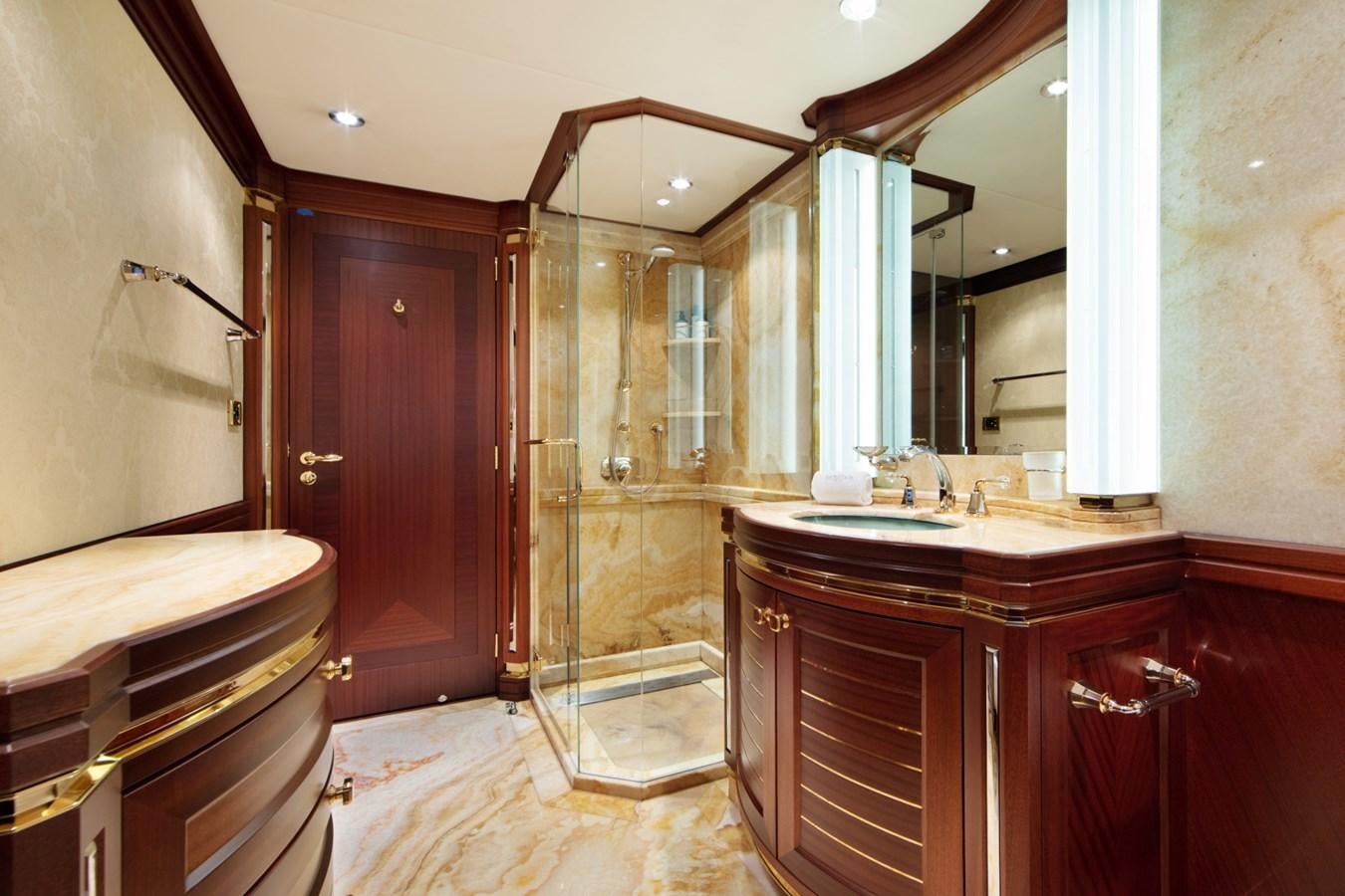 a bathroom with a glass shower aboard OLMIDA Yacht for Sale