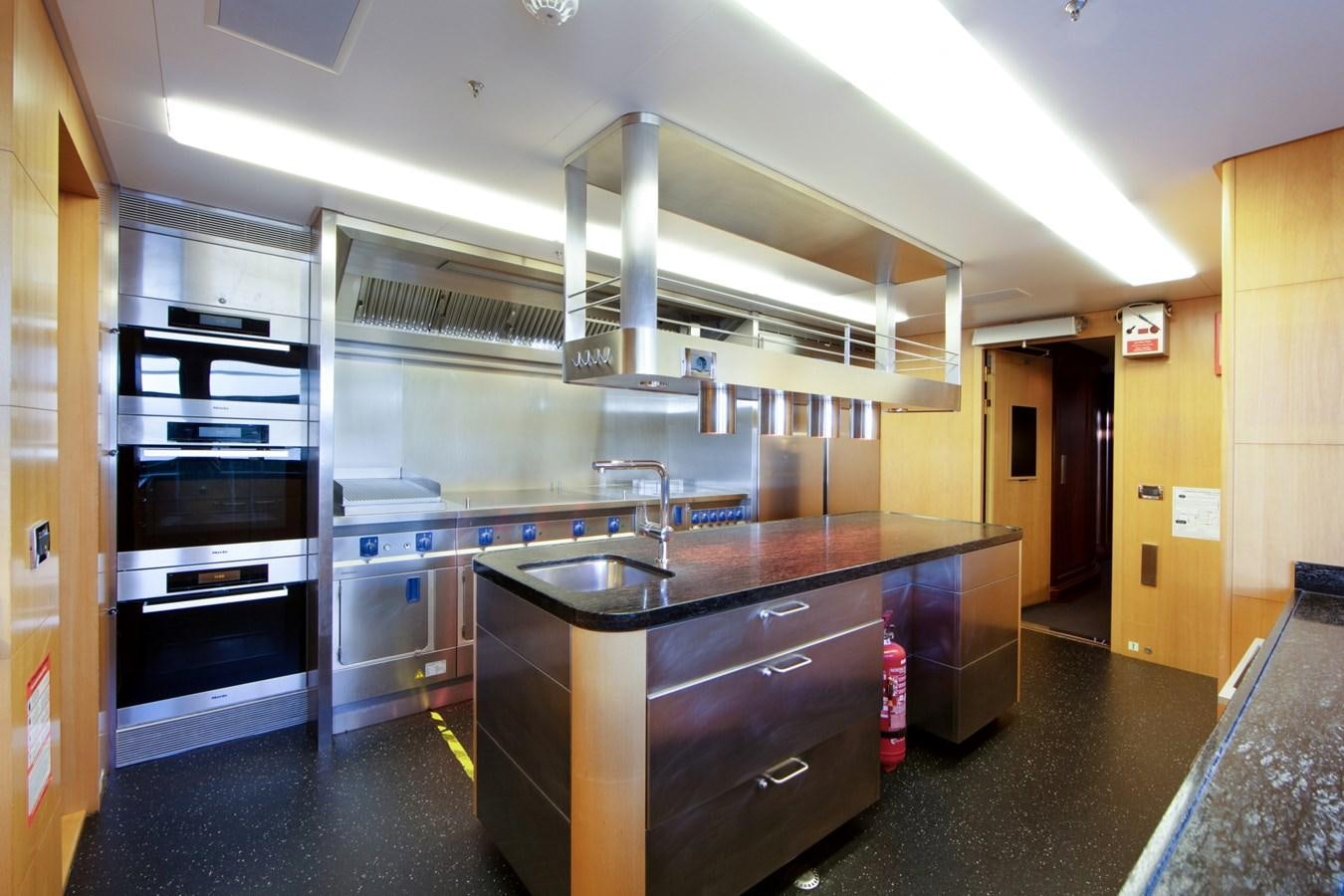 a kitchen with a stainless steel oven aboard OLMIDA Yacht for Sale