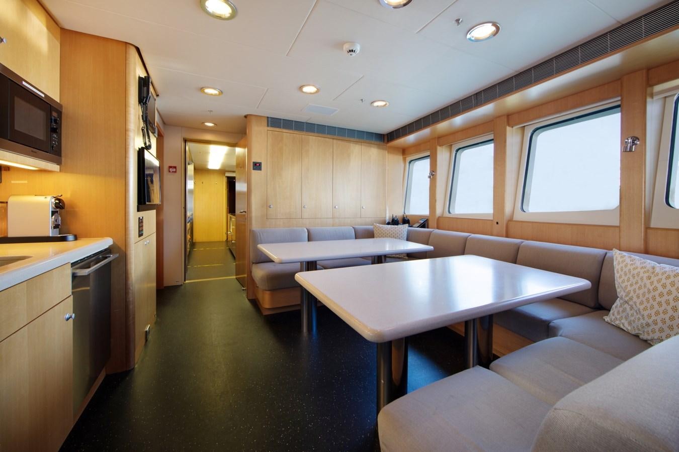 a kitchen and living room aboard OLMIDA Yacht for Sale