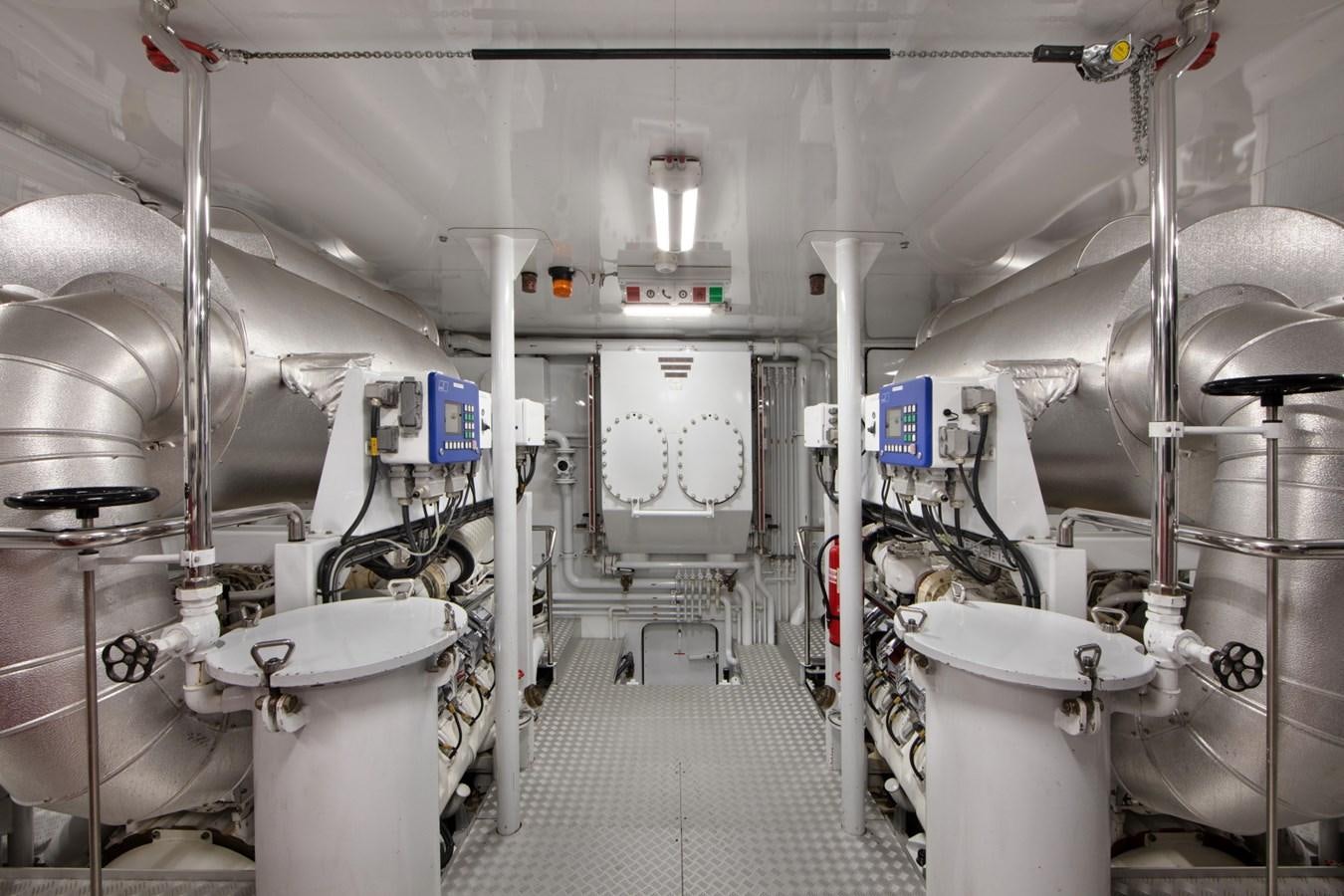 a bathroom with pipes and equipment aboard OLMIDA Yacht for Sale