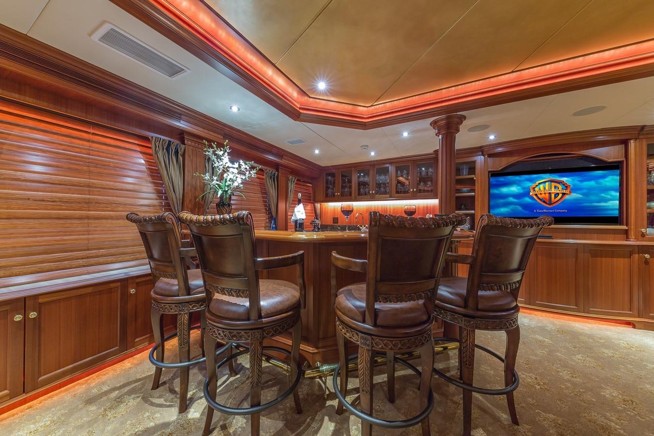 a bar with a bar and chairs aboard SORCHA Yacht for Sale