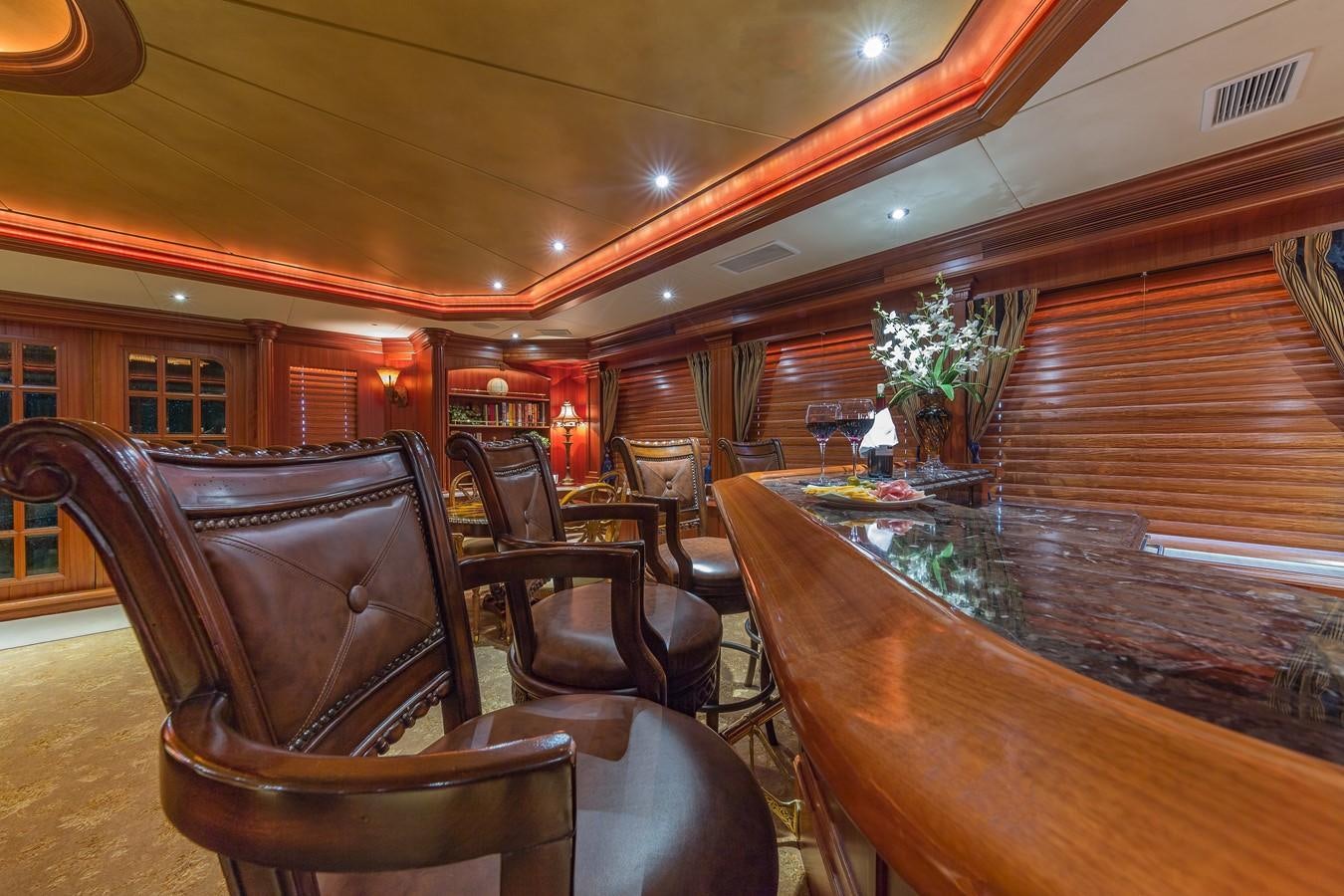 a room with a table and chairs aboard SORCHA Yacht for Sale
