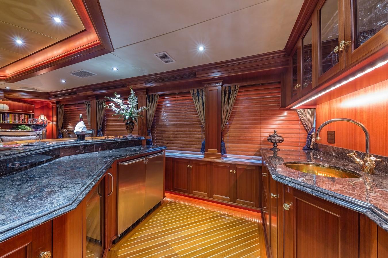a kitchen with a large island aboard SORCHA Yacht for Sale