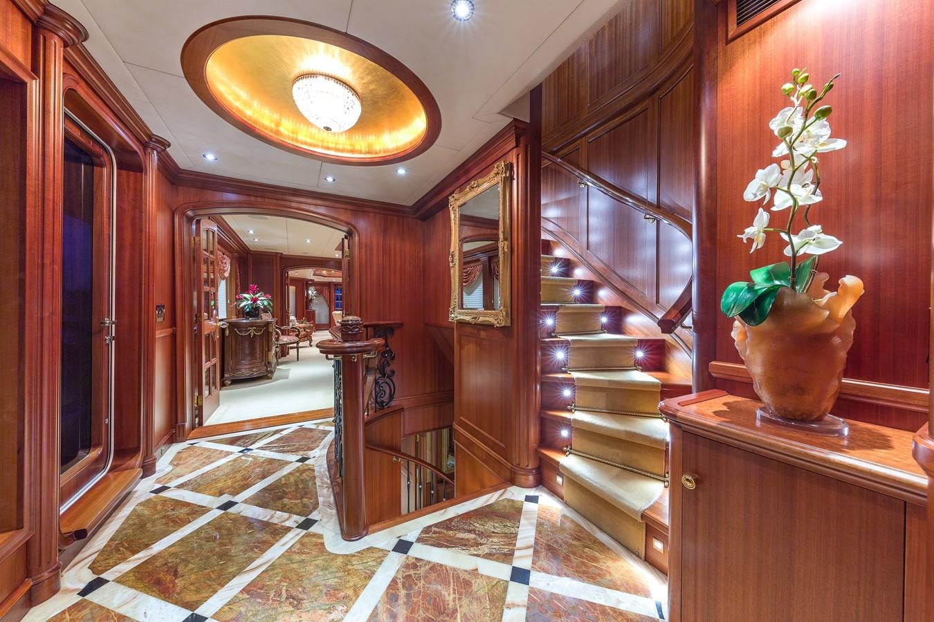 a room with wood walls and a chandelier aboard SORCHA Yacht for Sale