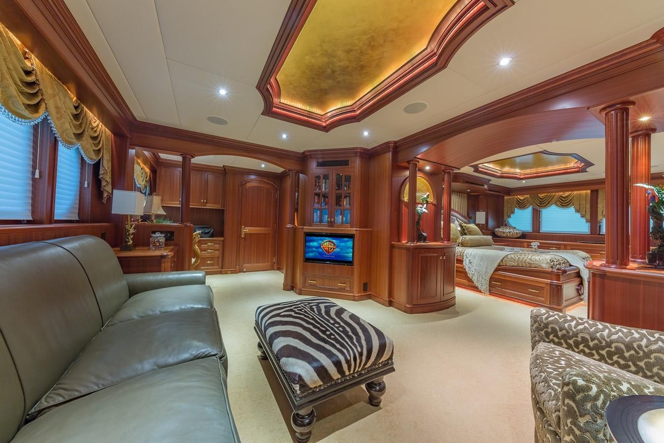 a living room with a couch and a fireplace aboard SORCHA Yacht for Sale