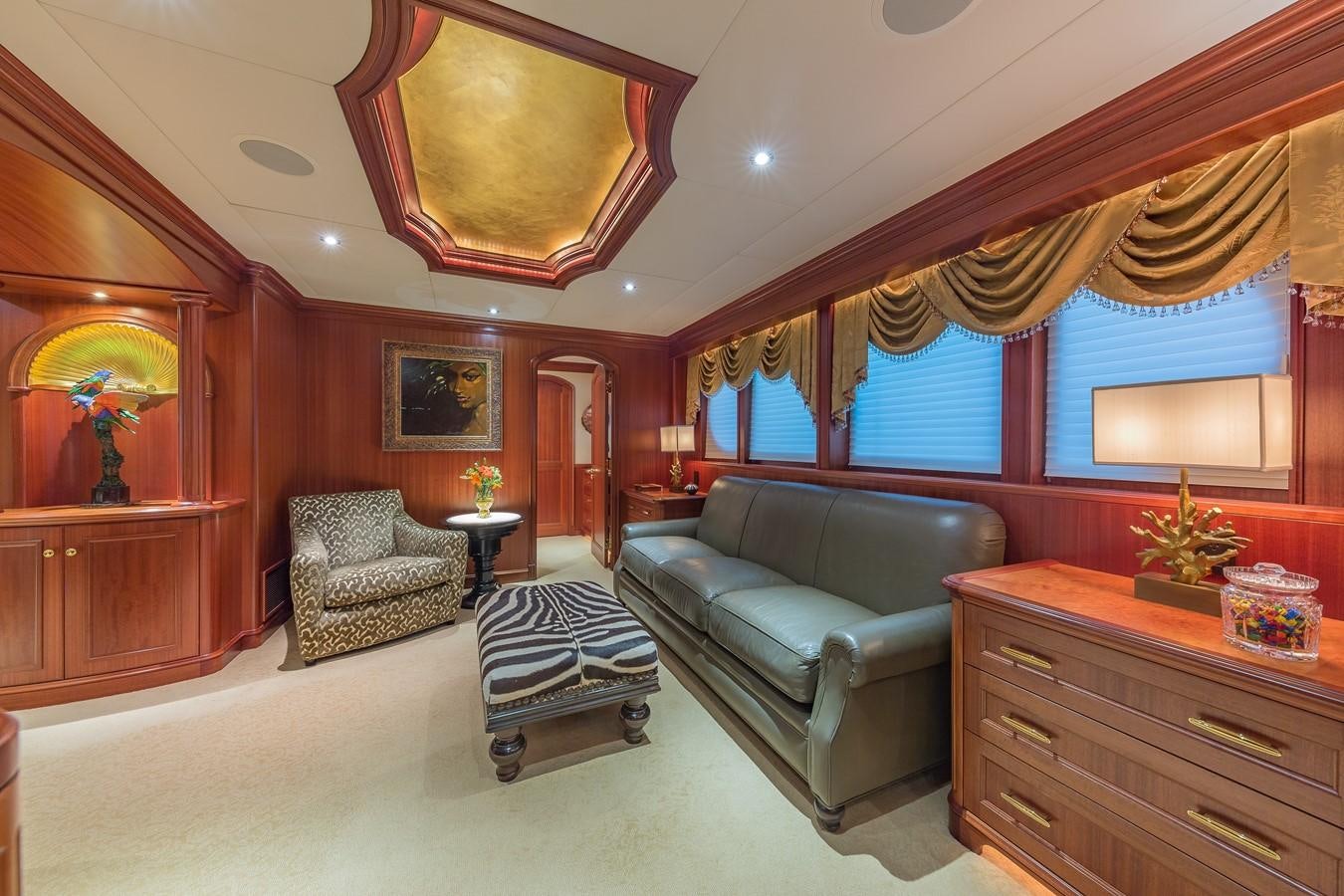 a living room with a couch and a table aboard SORCHA Yacht for Sale