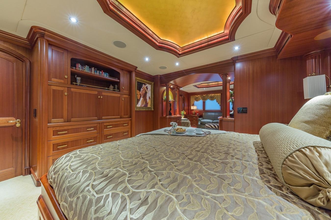a bedroom with a bed and a cupboard aboard SORCHA Yacht for Sale