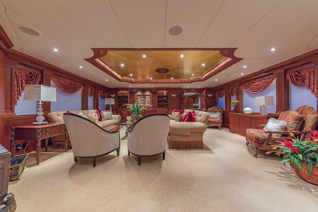 a living room with a couch and a table aboard SORCHA Yacht for Sale