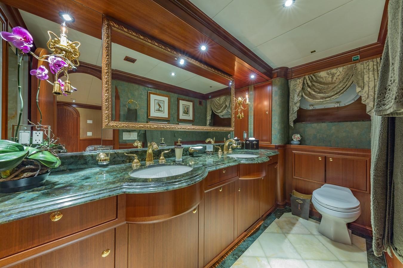 a bathroom with a large mirror aboard SORCHA Yacht for Sale
