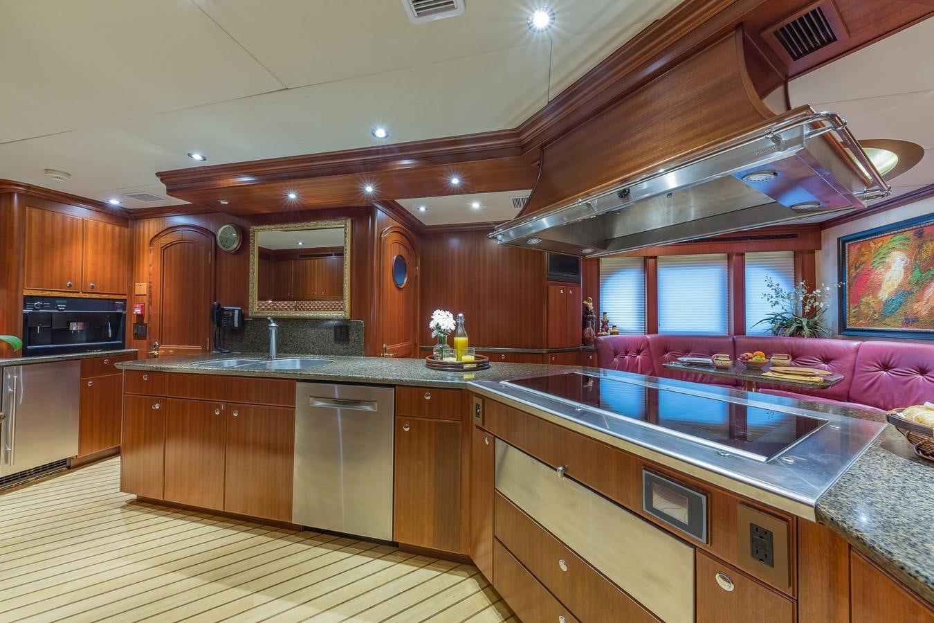 a kitchen with wooden cabinets aboard SORCHA Yacht for Sale