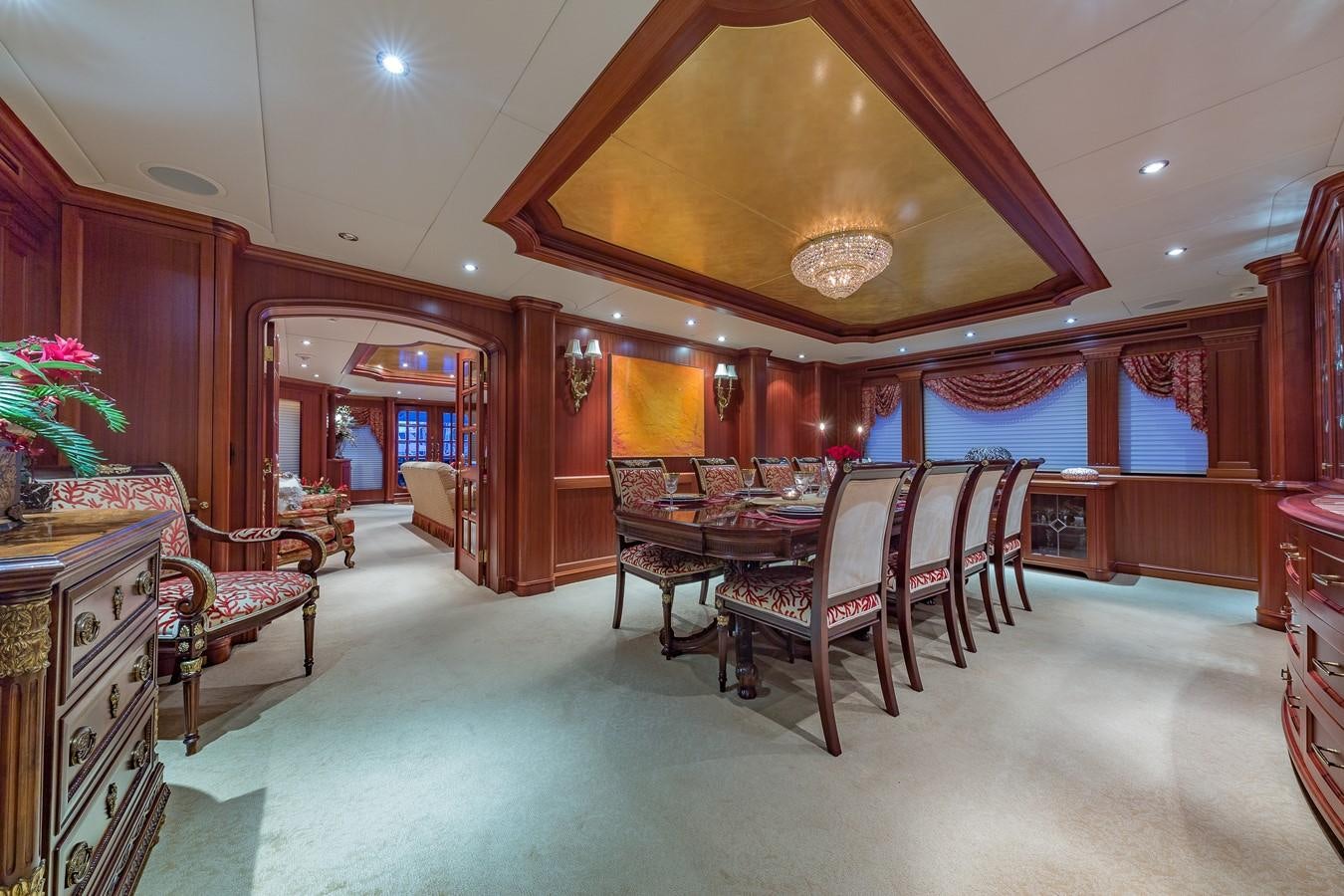 a large room with a table and chairs aboard SORCHA Yacht for Sale