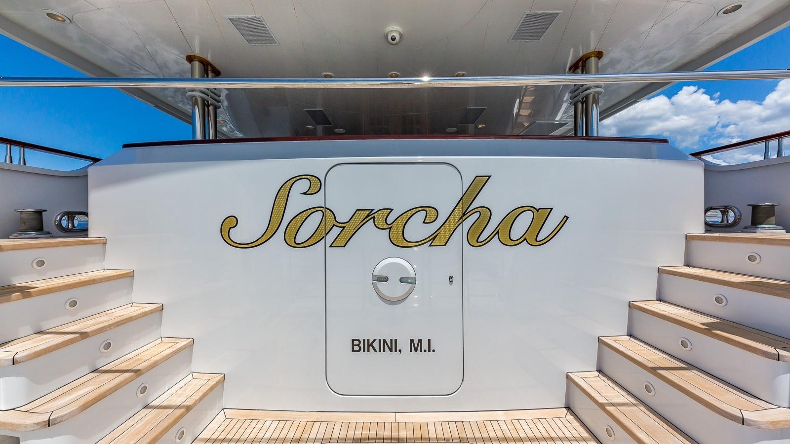 a white sign with yellow text on it aboard SORCHA Yacht for Sale