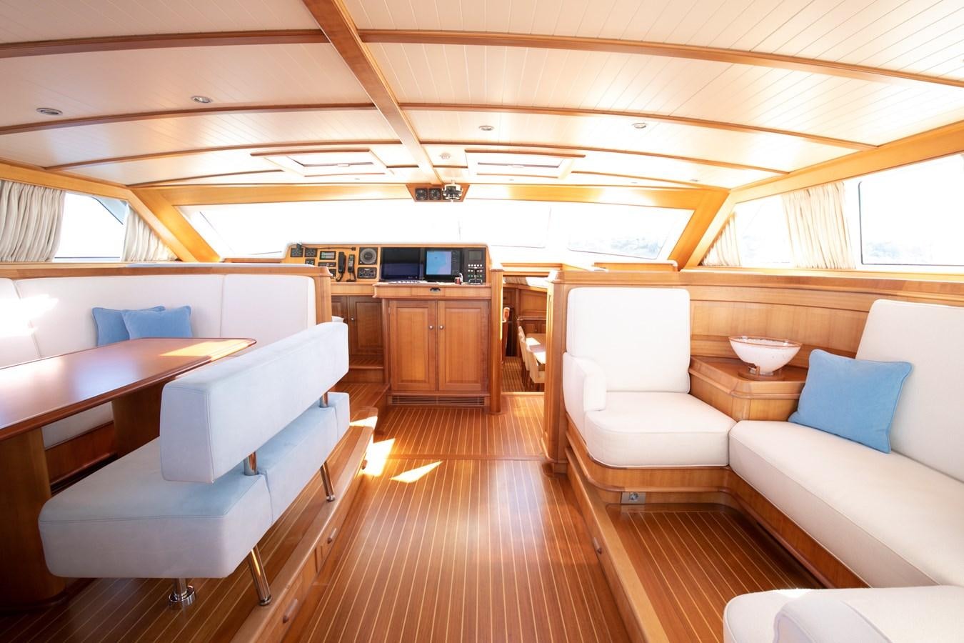 a living room with a wood floor aboard WELLENREITER Yacht for Sale
