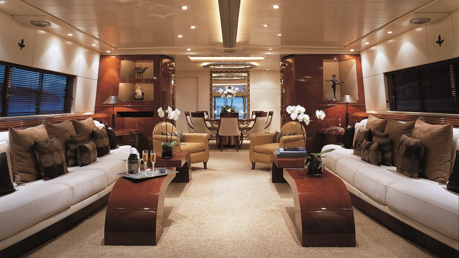 a living room with a white couch and a coffee table aboard COSTA MAGNA Yacht for Sale