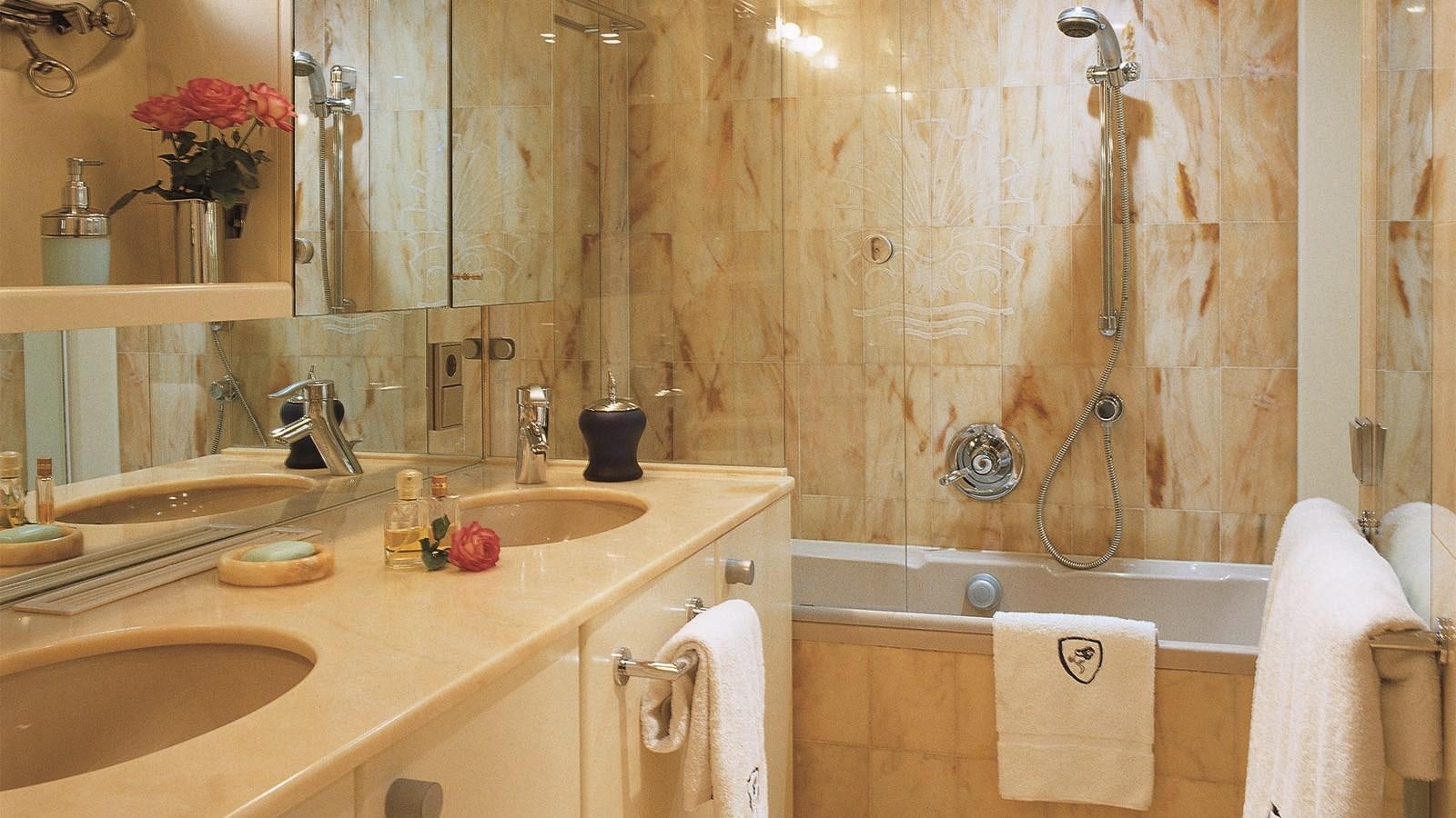 a bathroom with a shower curtain and sink aboard COSTA MAGNA Yacht for Sale