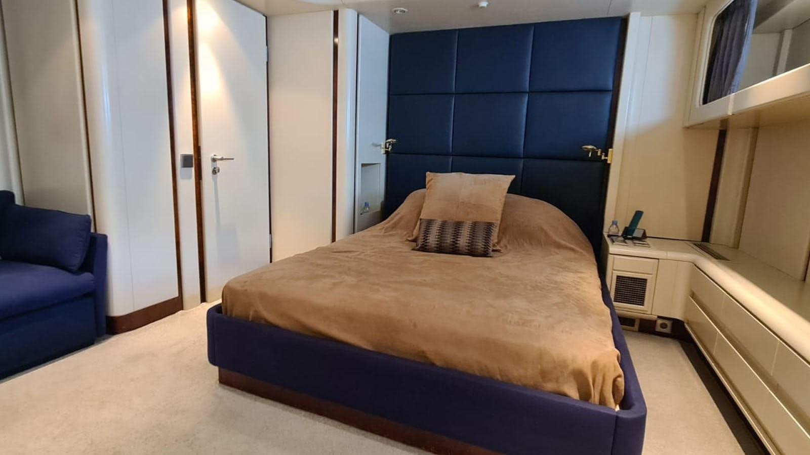 a bed in a room aboard COSTA MAGNA Yacht for Sale
