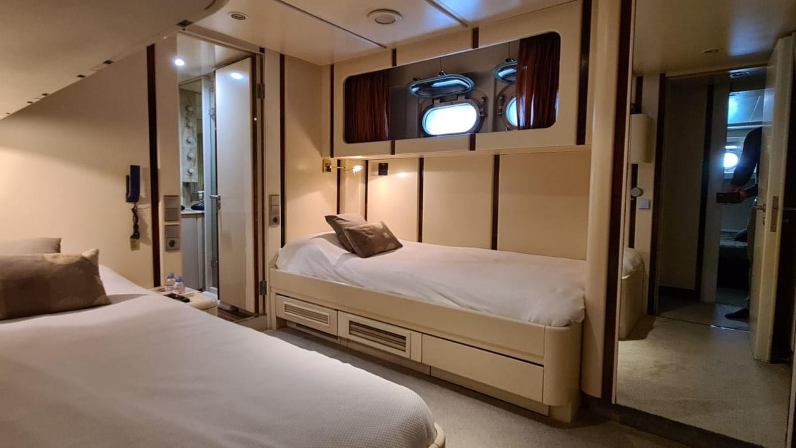 a room with two beds aboard COSTA MAGNA Yacht for Sale
