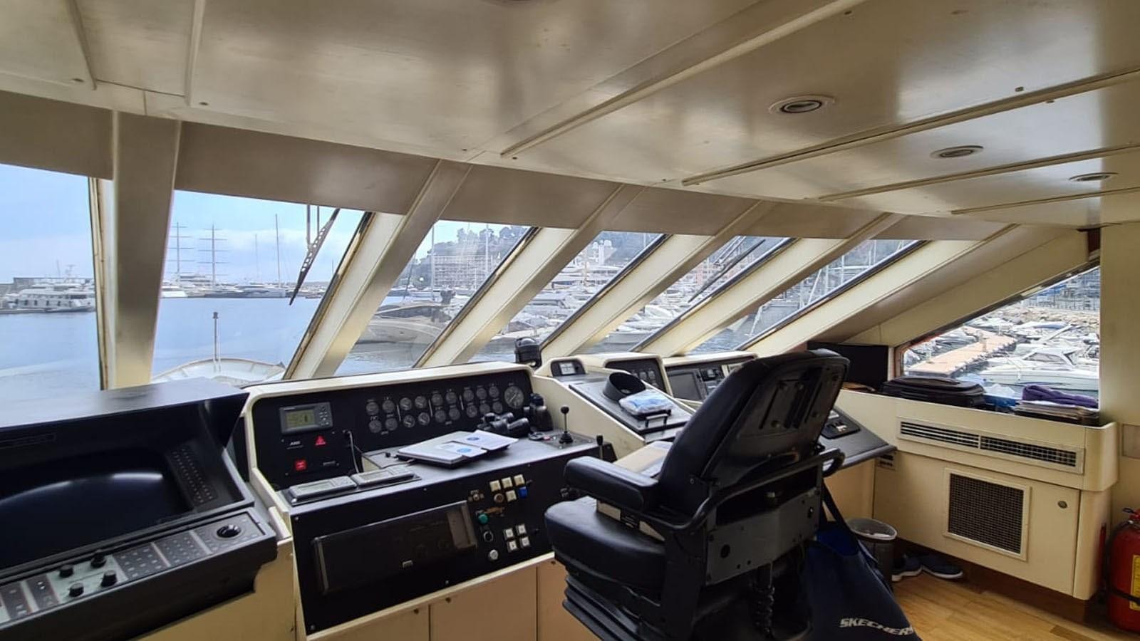 a room with a desk and a chair aboard COSTA MAGNA Yacht for Sale