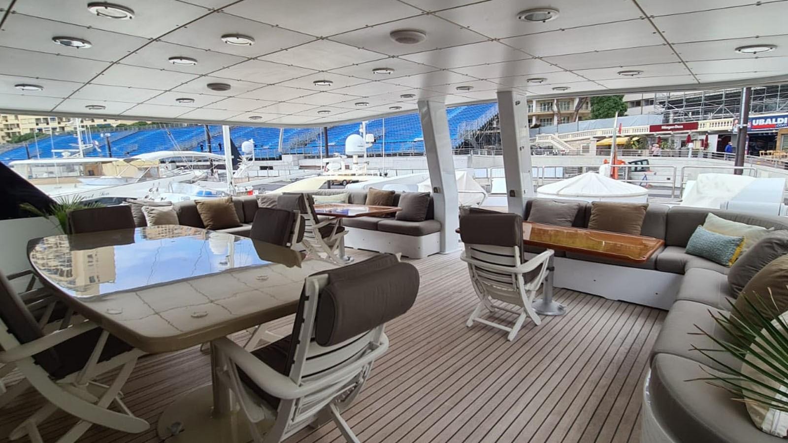 a room with a pool table and chairs aboard COSTA MAGNA Yacht for Sale