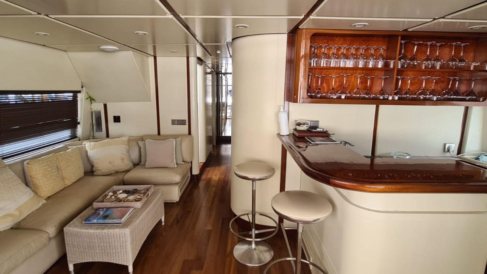 a living room with a piano aboard COSTA MAGNA Yacht for Sale