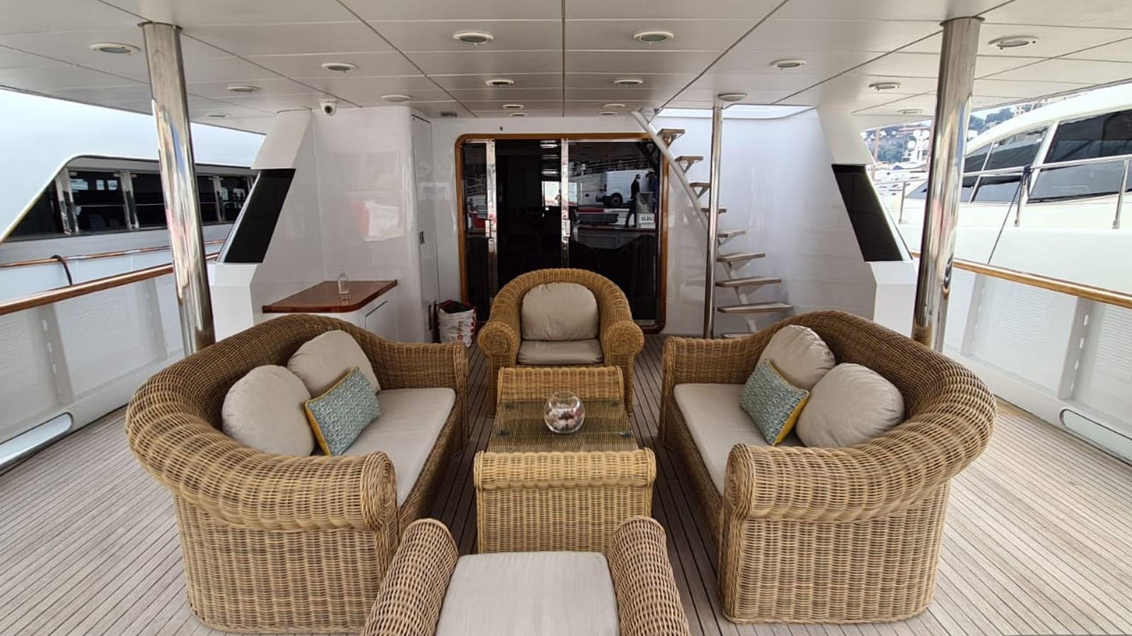 a couple of chairs in a bus aboard COSTA MAGNA Yacht for Sale