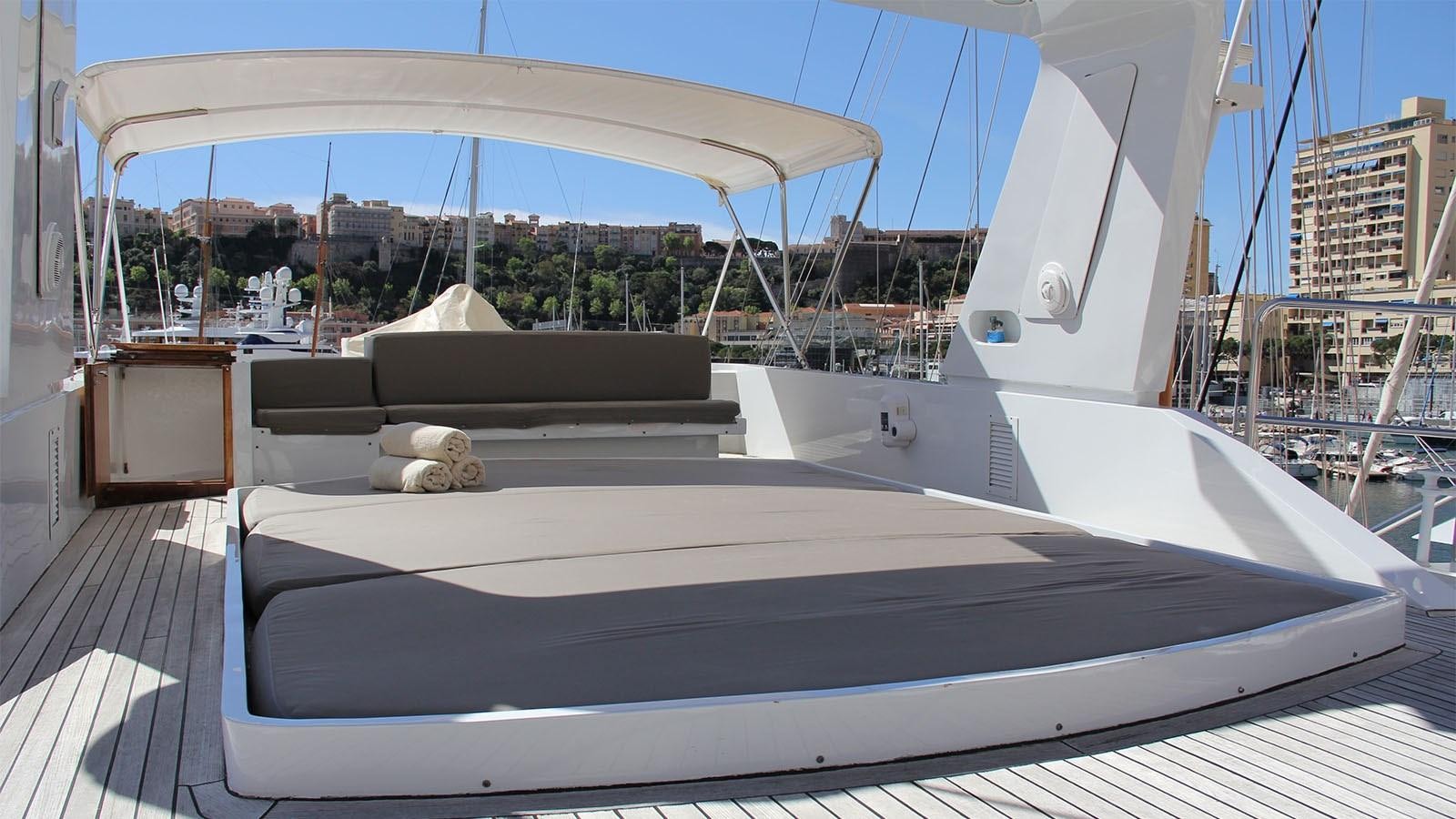 a large white boat with a white canopy aboard COSTA MAGNA Yacht for Sale