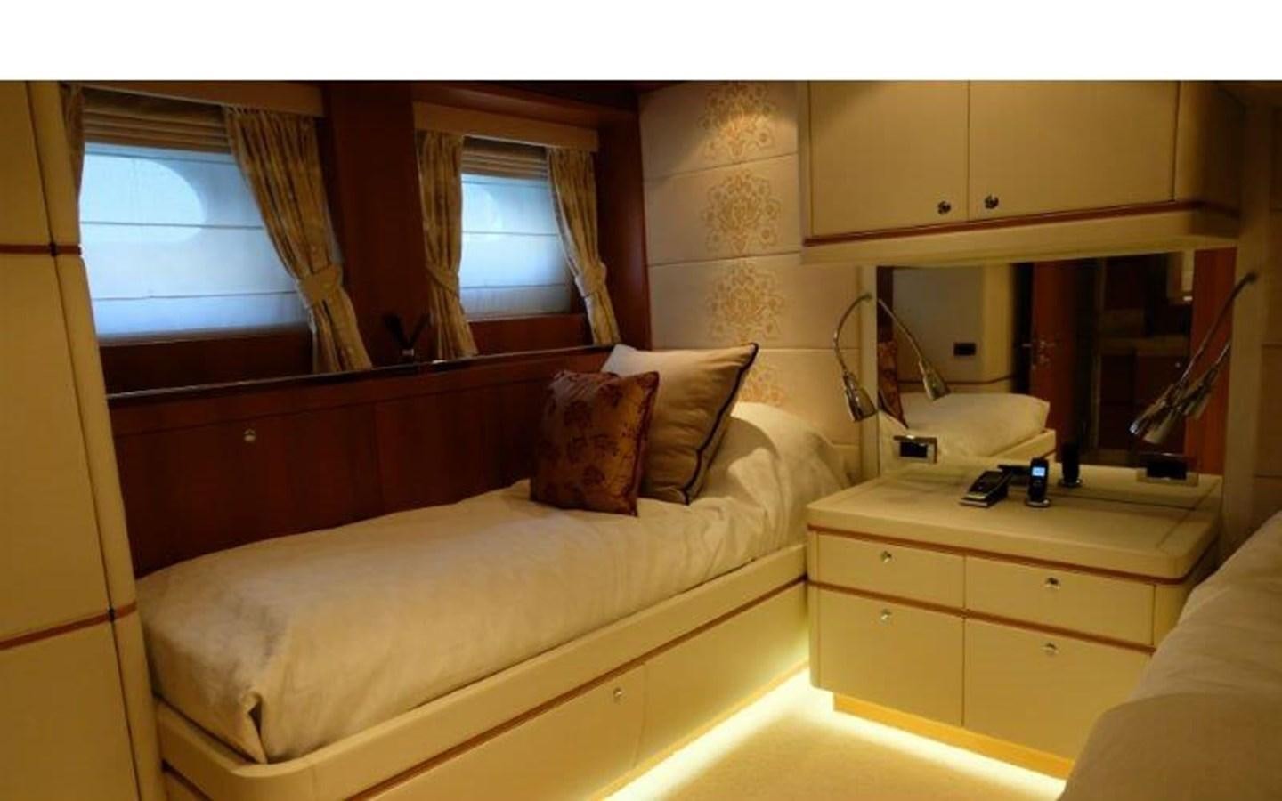 a bedroom with a bed and a mirror aboard MORDAN Yacht for Sale
