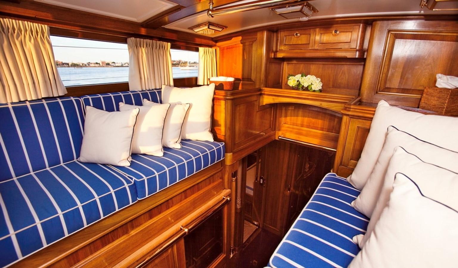 a room with a bed and a blue bed aboard HANUMAN Yacht for Sale