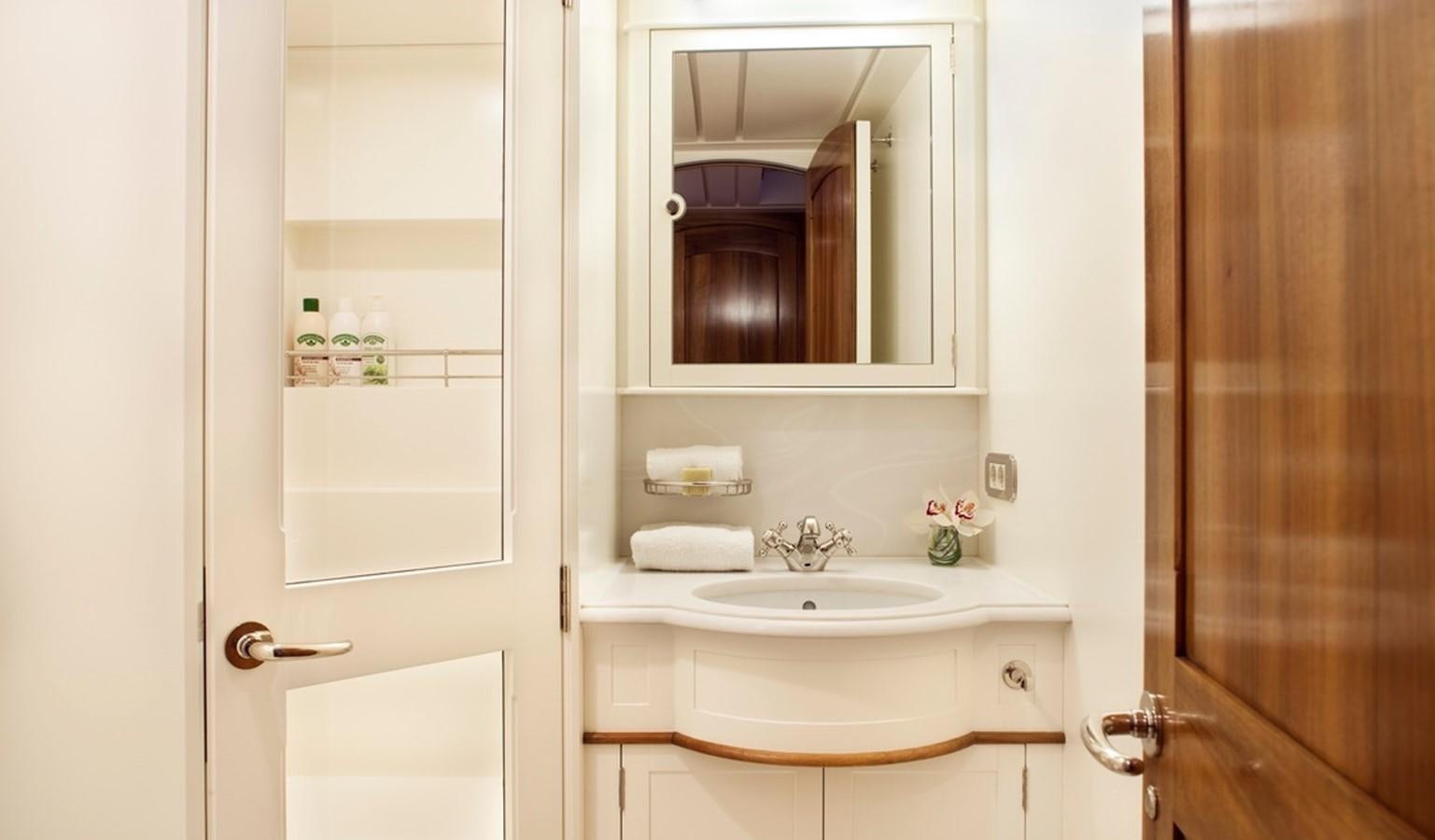 a bathroom with a mirror aboard HANUMAN Yacht for Sale