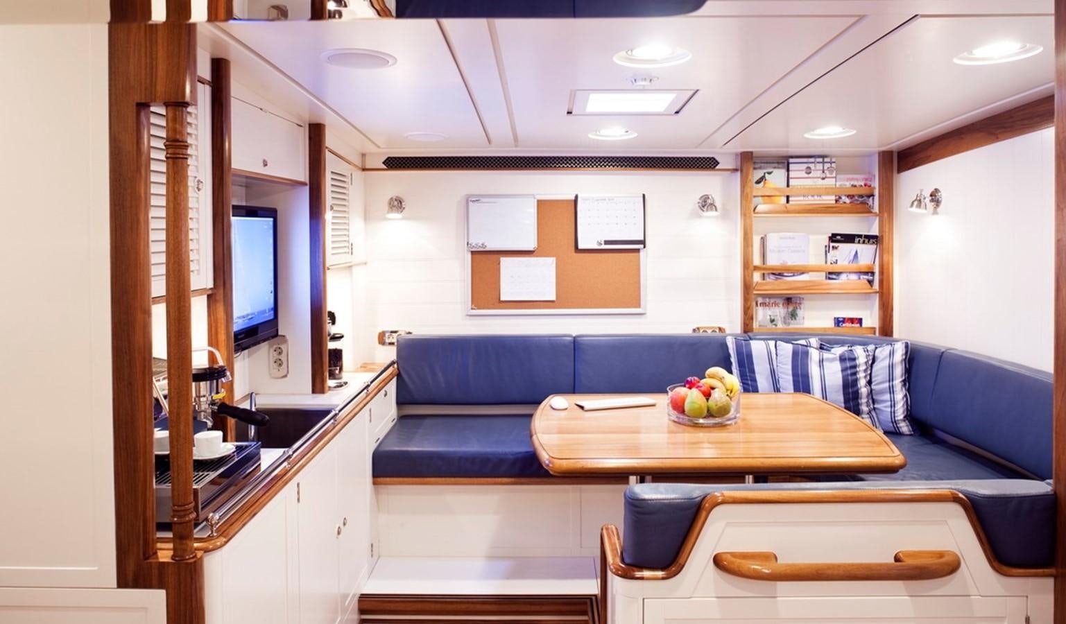 a room with a couch and a table aboard HANUMAN Yacht for Sale