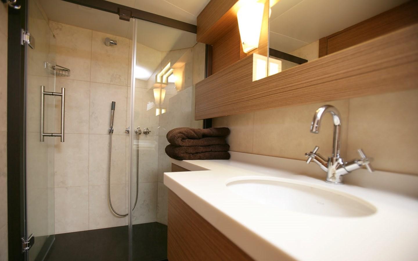 a bathroom with a shower and a sink aboard PATRIOT 41 Yacht for Sale