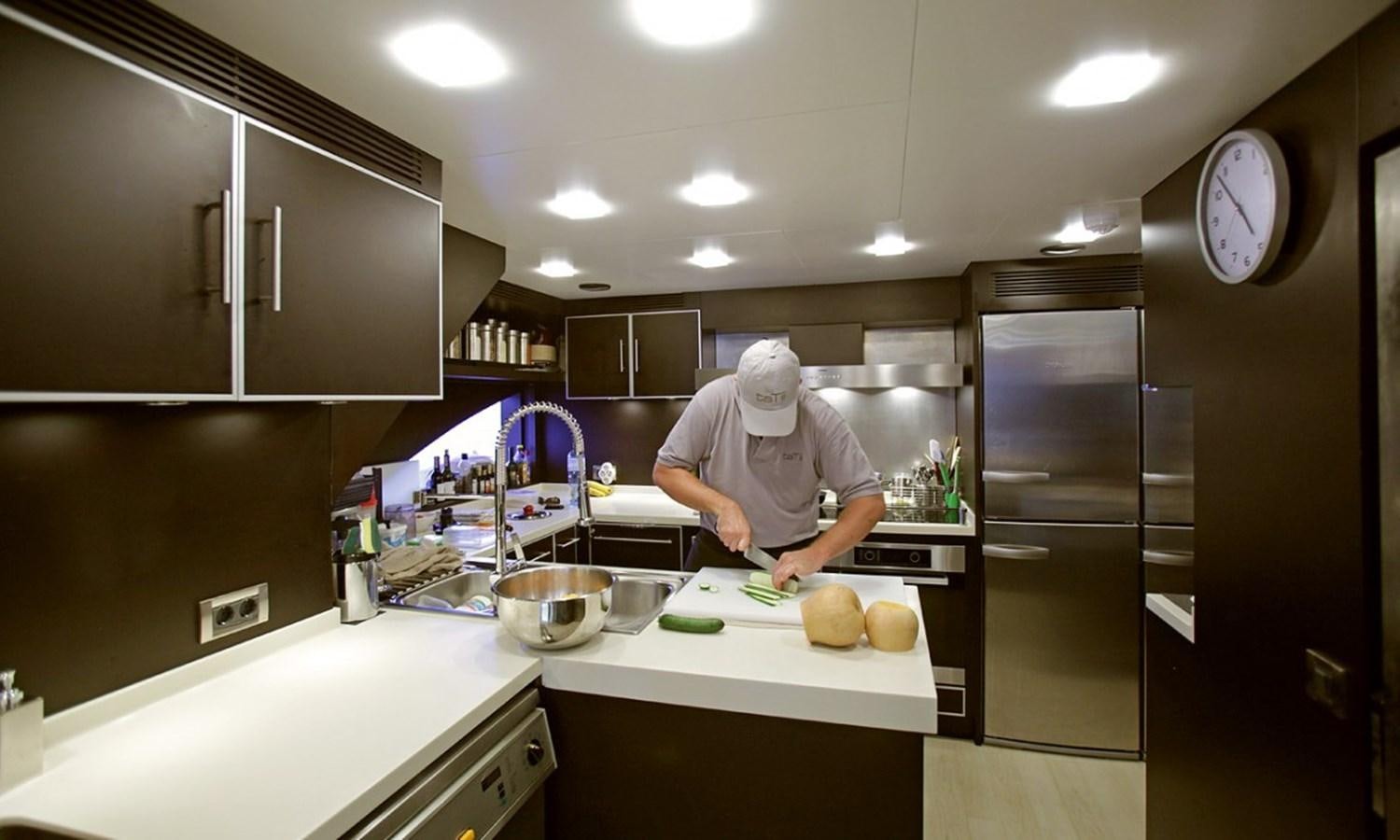 a man in a kitchen aboard PATRIOT 41 Yacht for Sale