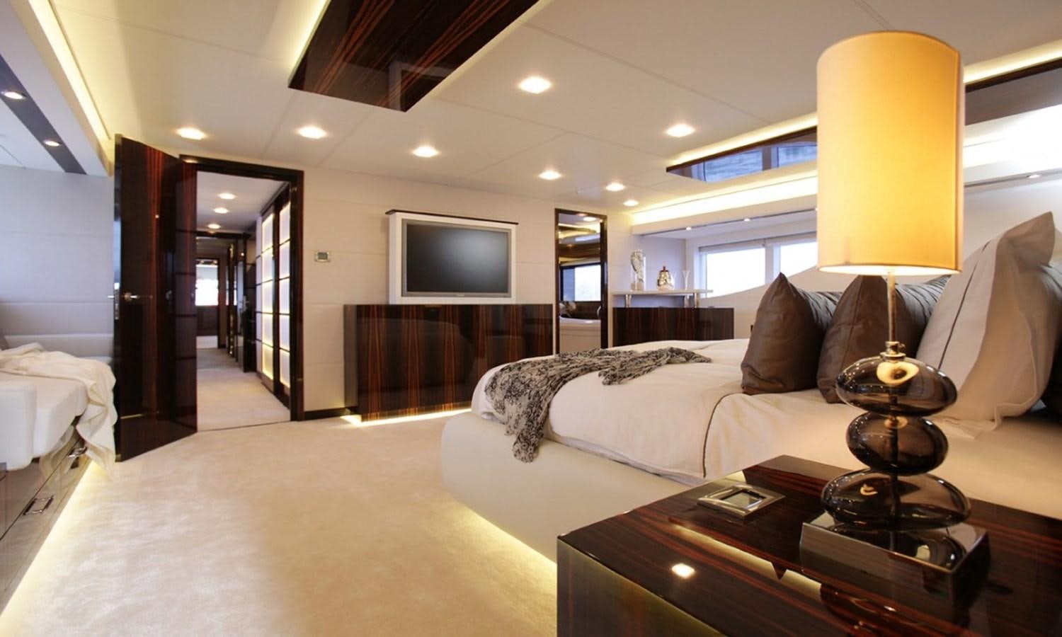 a hotel room with a bed and a tv aboard PATRIOT 41 Yacht for Sale