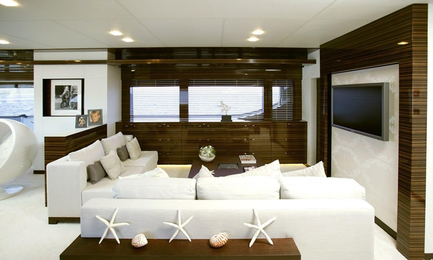 a large white couch in a room aboard PATRIOT 41 Yacht for Sale