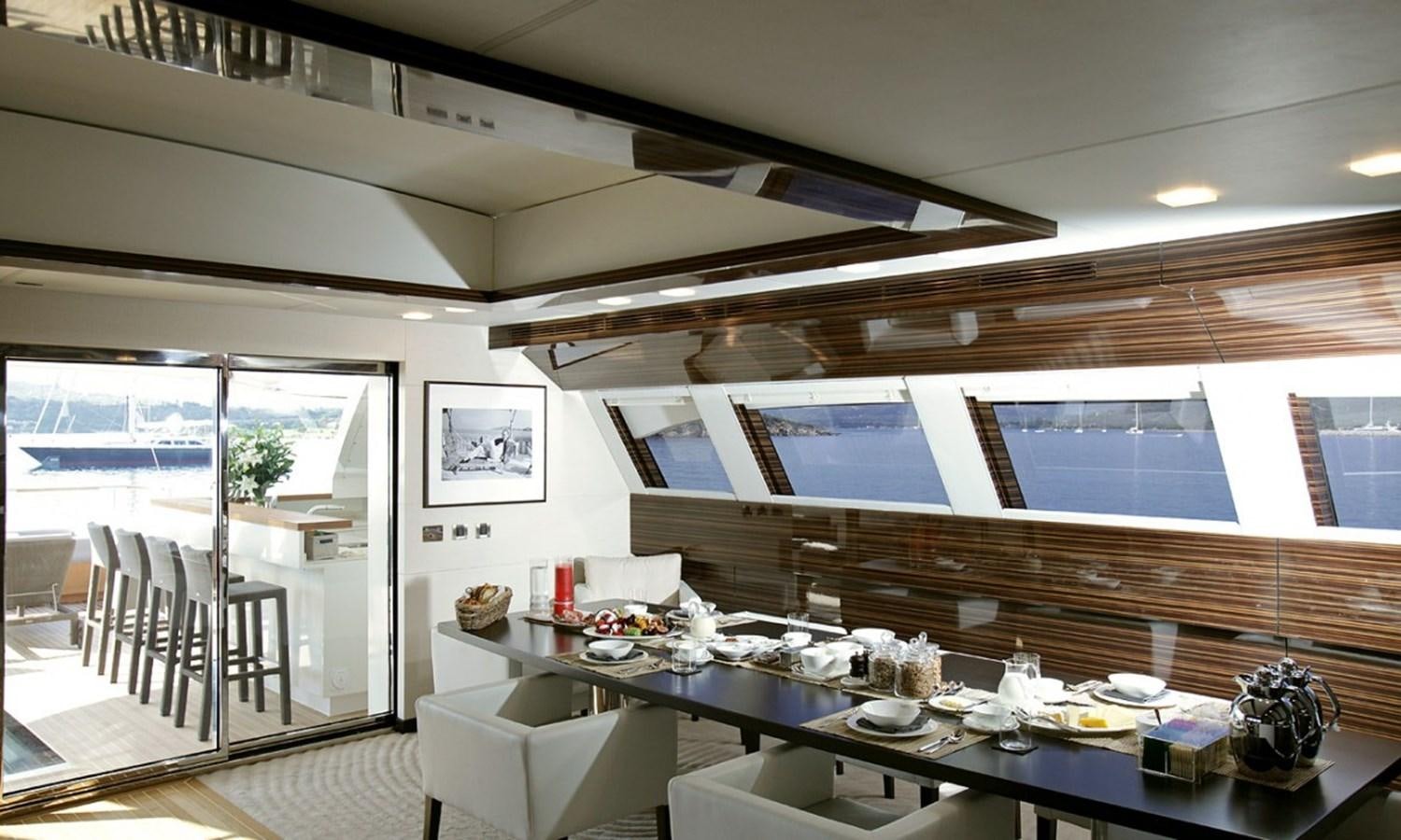 a large kitchen with a table and chairs aboard PATRIOT 41 Yacht for Sale