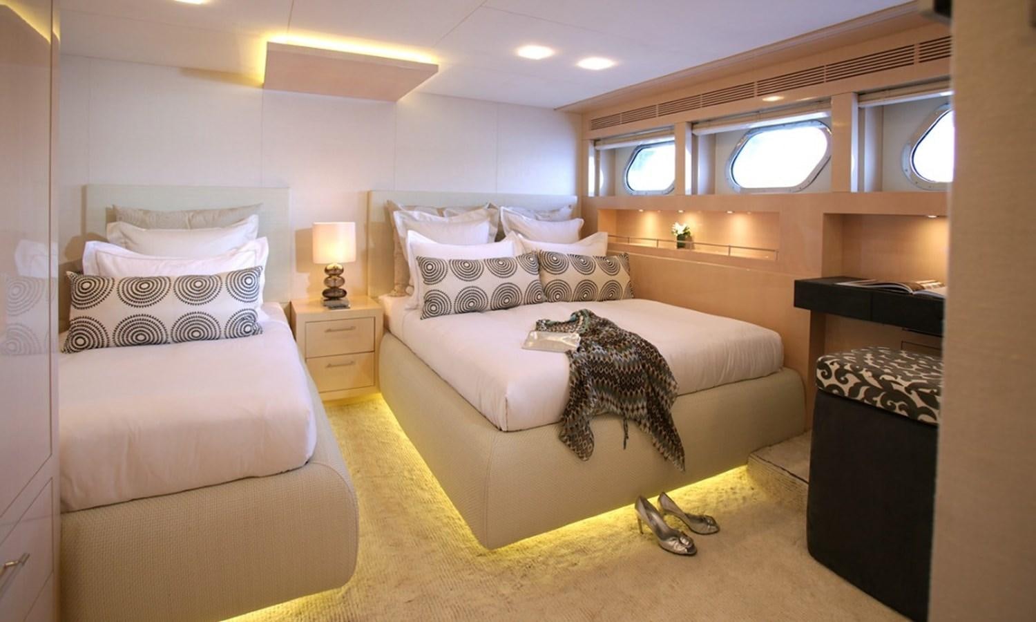 a couple of beds in a hotel room aboard PATRIOT 41 Yacht for Sale