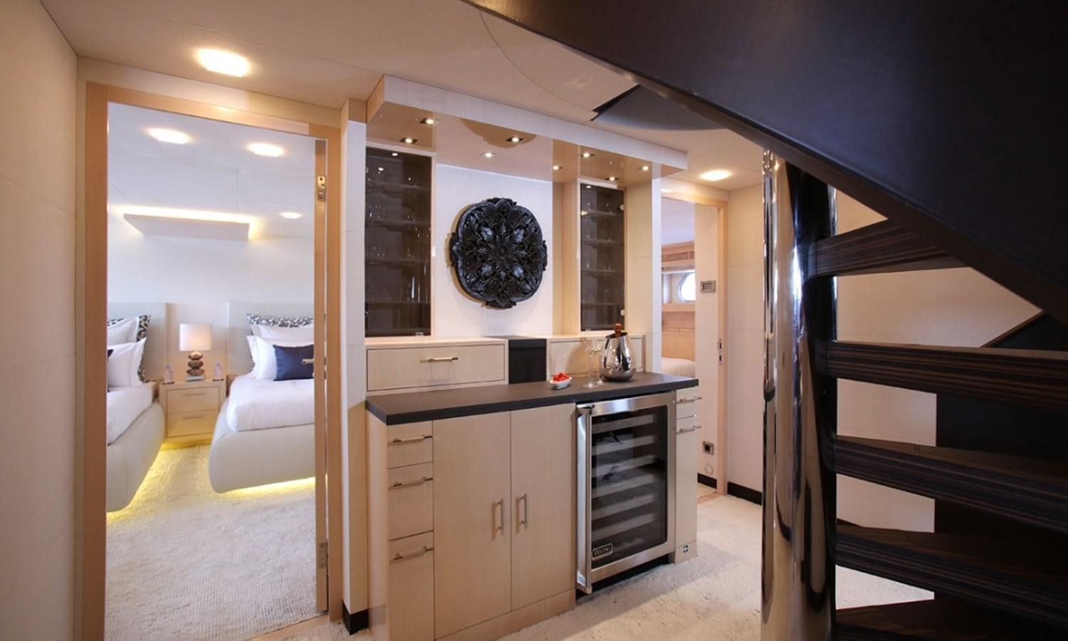 a room with a bed and a desk aboard PATRIOT 41 Yacht for Sale