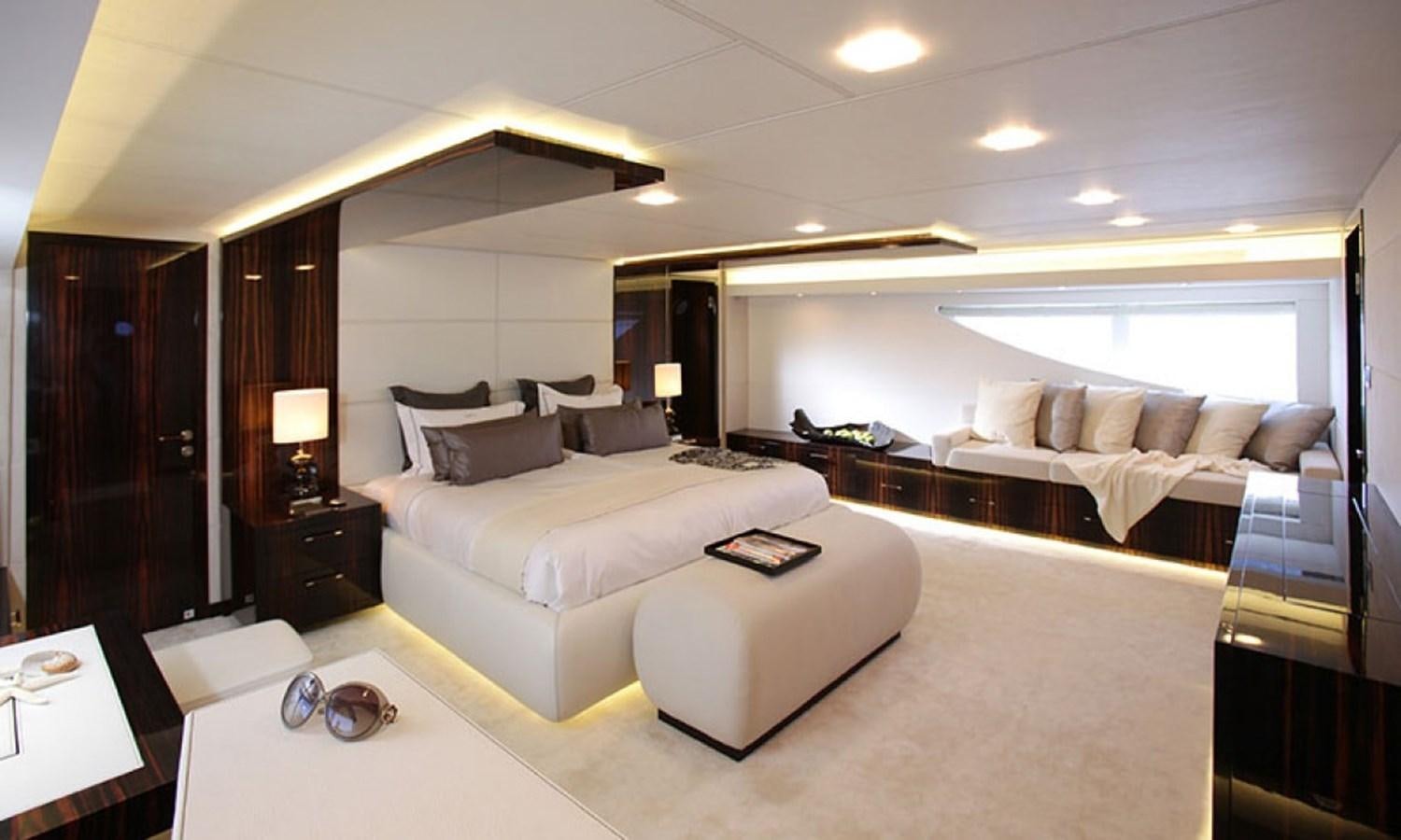 a hotel room with a bed and a desk aboard PATRIOT 41 Yacht for Sale