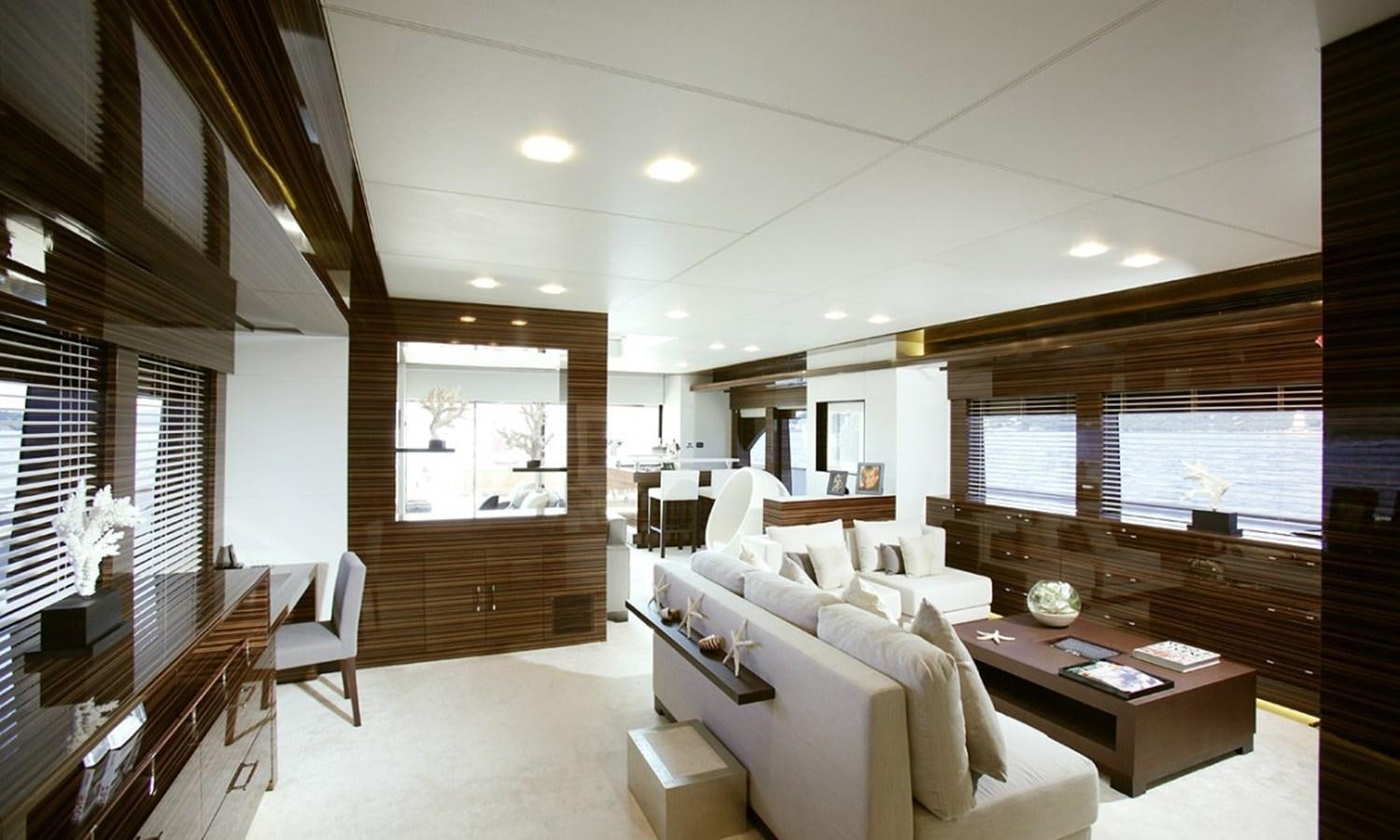 a living room with a couch and a coffee table aboard PATRIOT 41 Yacht for Sale