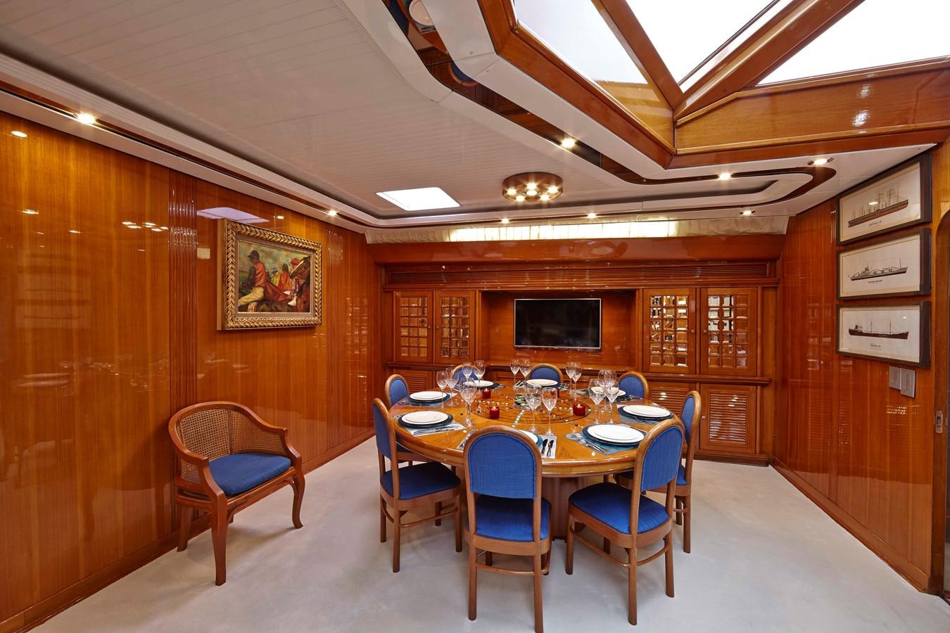 a room with a table and chairs aboard MIRABELLA Yacht for Sale