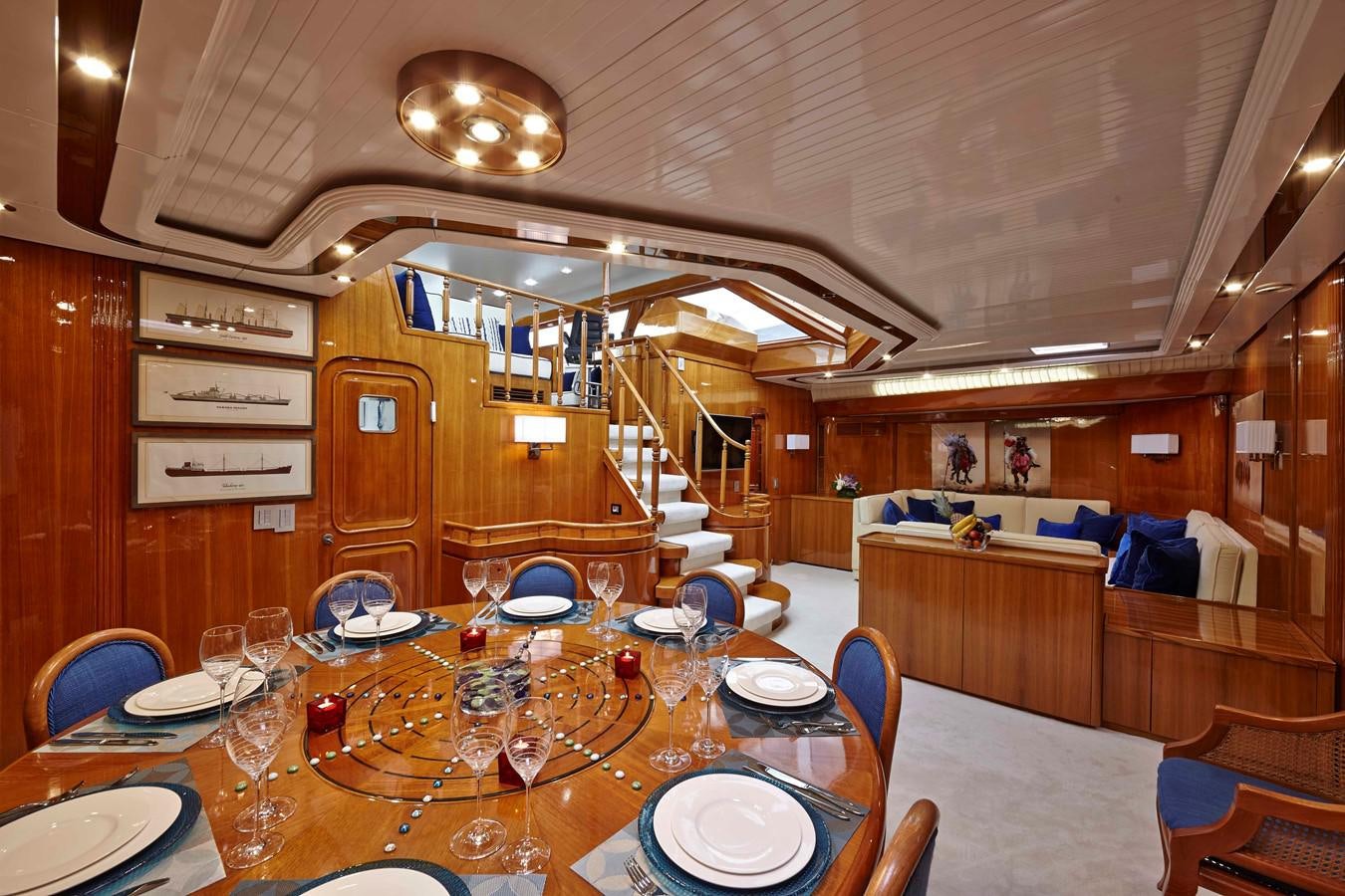 a dining room with a table set for a party aboard MIRABELLA Yacht for Sale