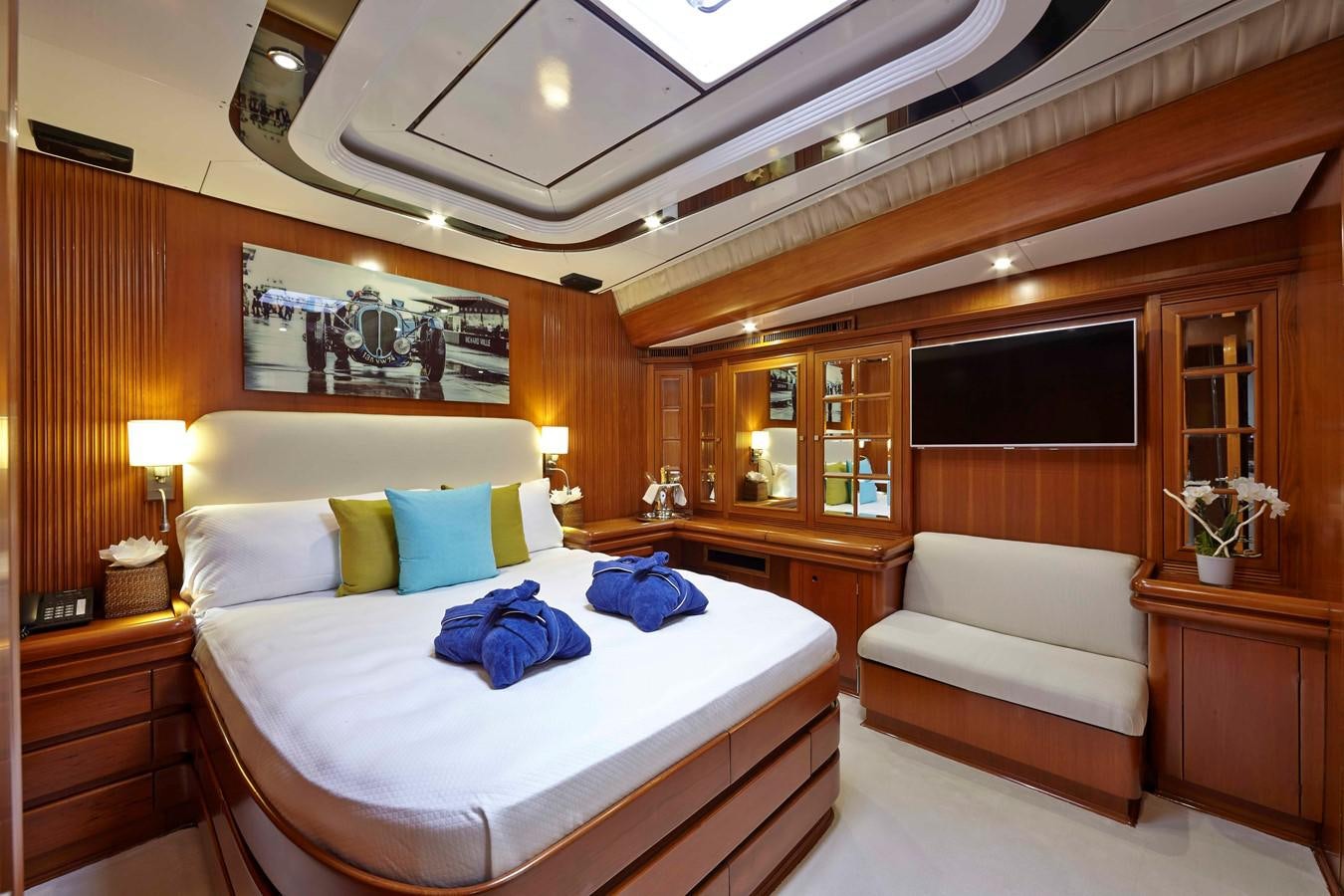 a room with a bed and a couch aboard MIRABELLA Yacht for Sale