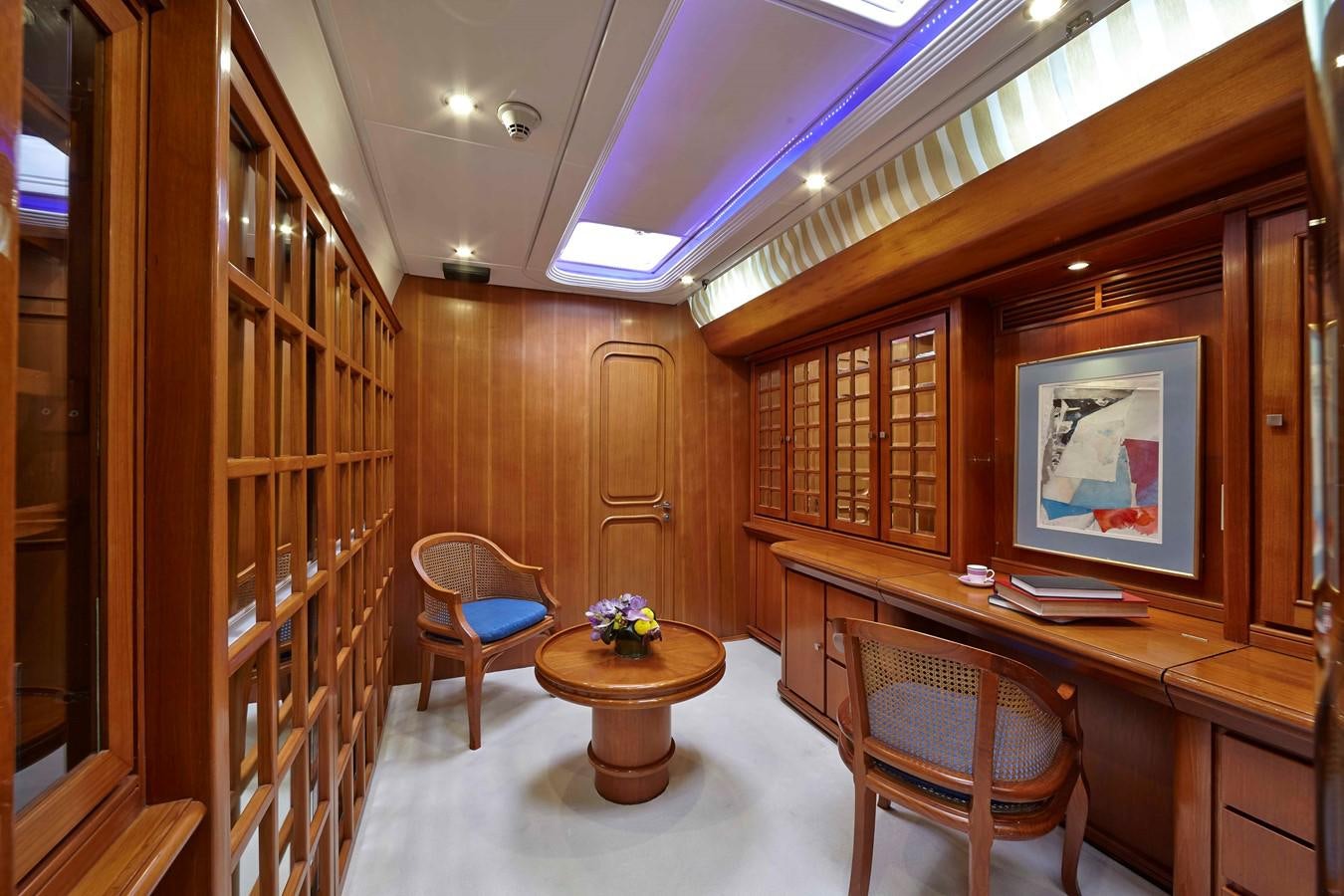 a room with a table chairs and a large window aboard MIRABELLA Yacht for Sale