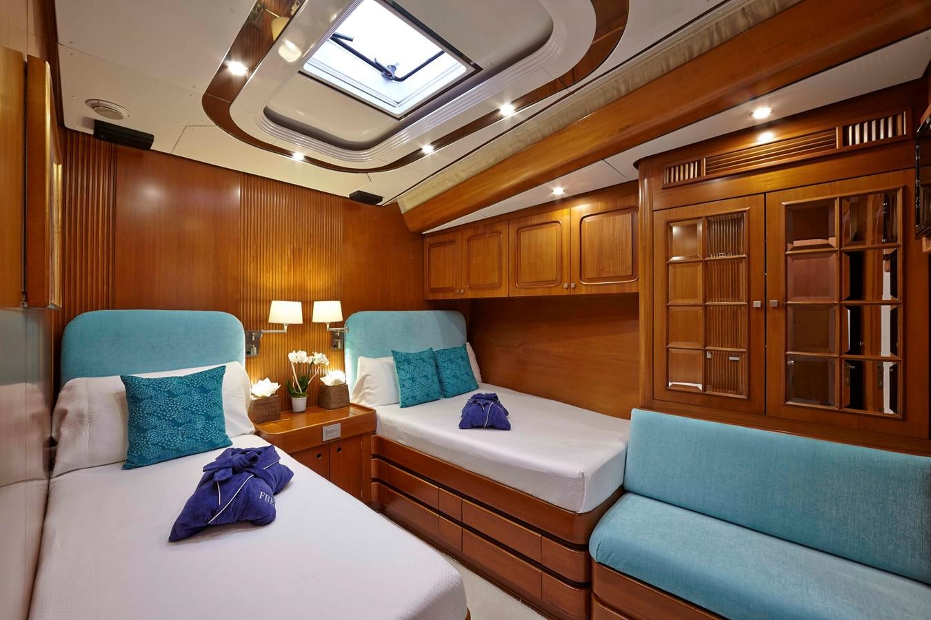 a room with a bed and a couch aboard MIRABELLA Yacht for Sale