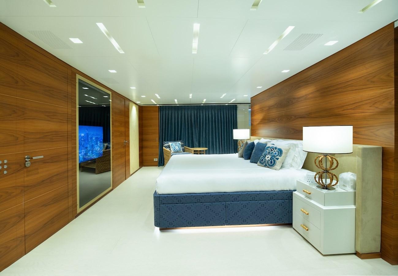 a bedroom with a bed and a desk aboard ASTERI Yacht for Sale