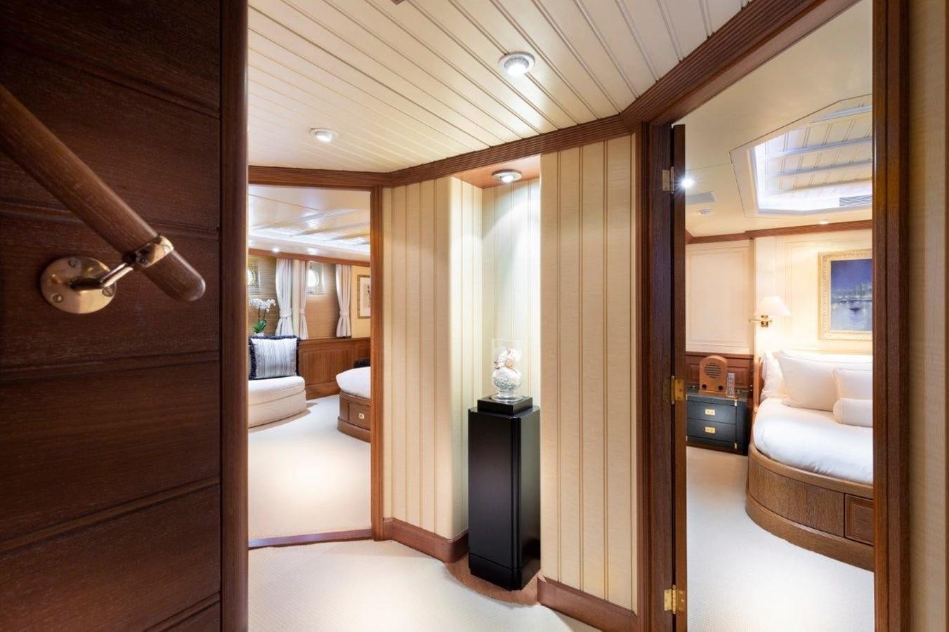a room with a wood door and a mirror aboard GLACIAL BEAR Yacht for Sale