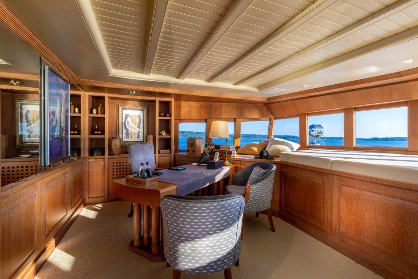 a room with a table and chairs aboard GLACIAL BEAR Yacht for Sale