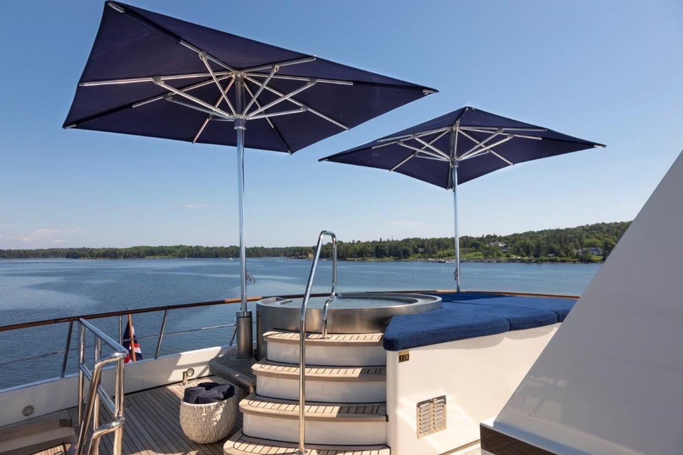 a boat with an umbrella aboard GLACIAL BEAR Yacht for Sale