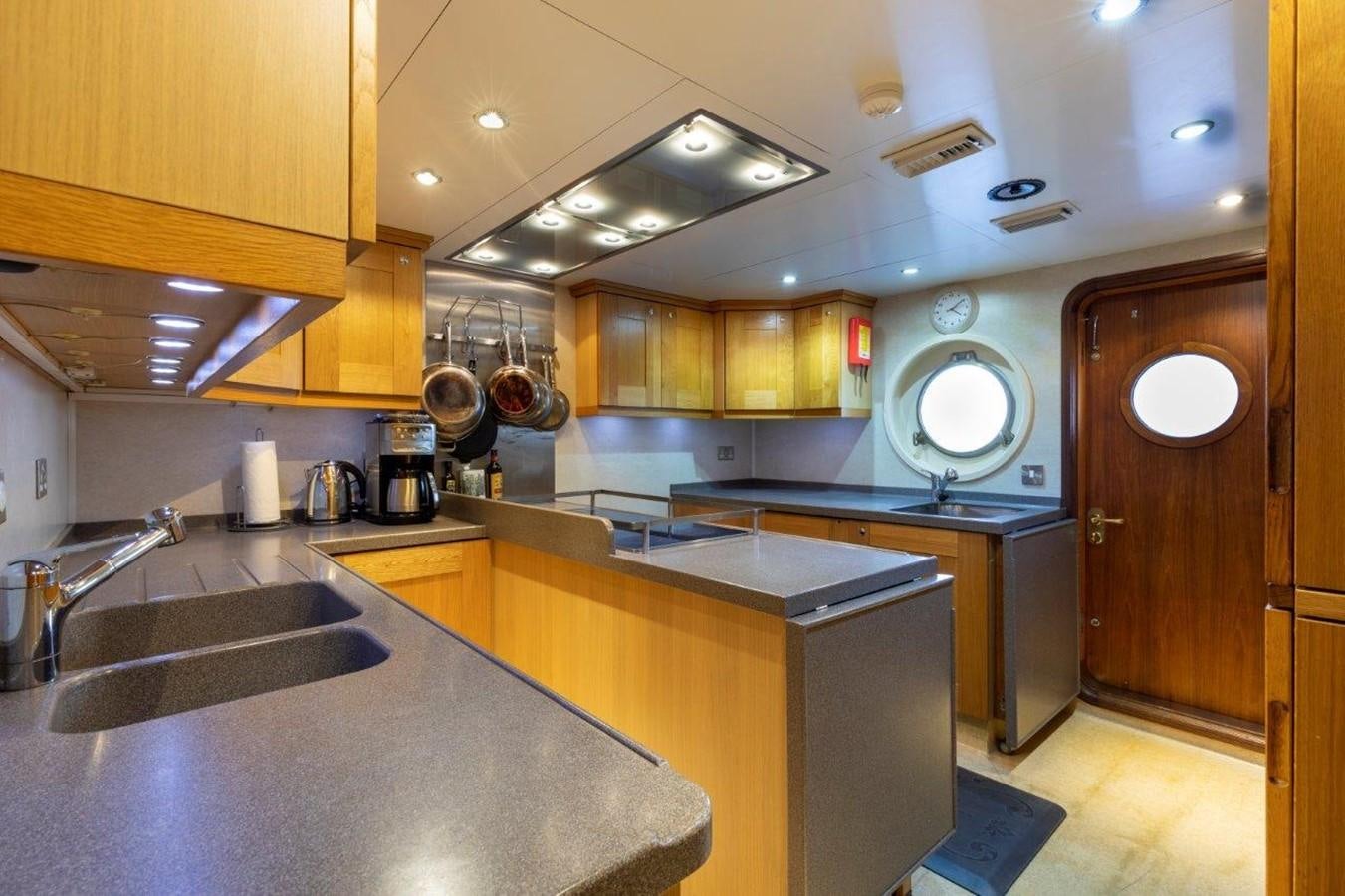 a kitchen with a large island aboard GLACIAL BEAR Yacht for Sale
