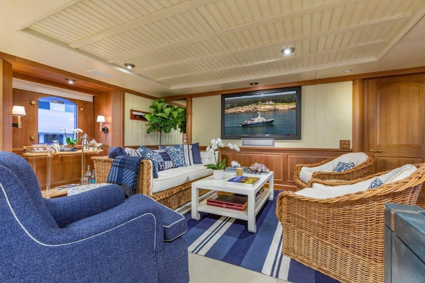 a living room with a couch and a television aboard GLACIAL BEAR Yacht for Sale